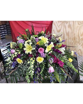 Shades of Purple with Yellow Casket Spray